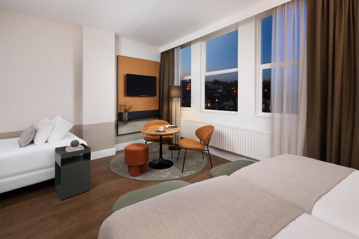 Standard Triple Room, City View | Minibar, in-room safe, desk, blackout drapes