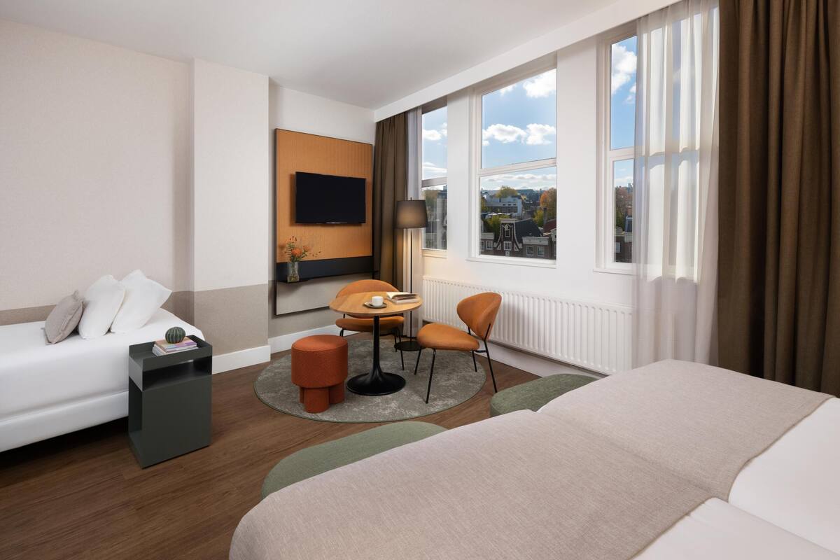 Standard Triple Room | Minibar, in-room safe, desk, blackout drapes