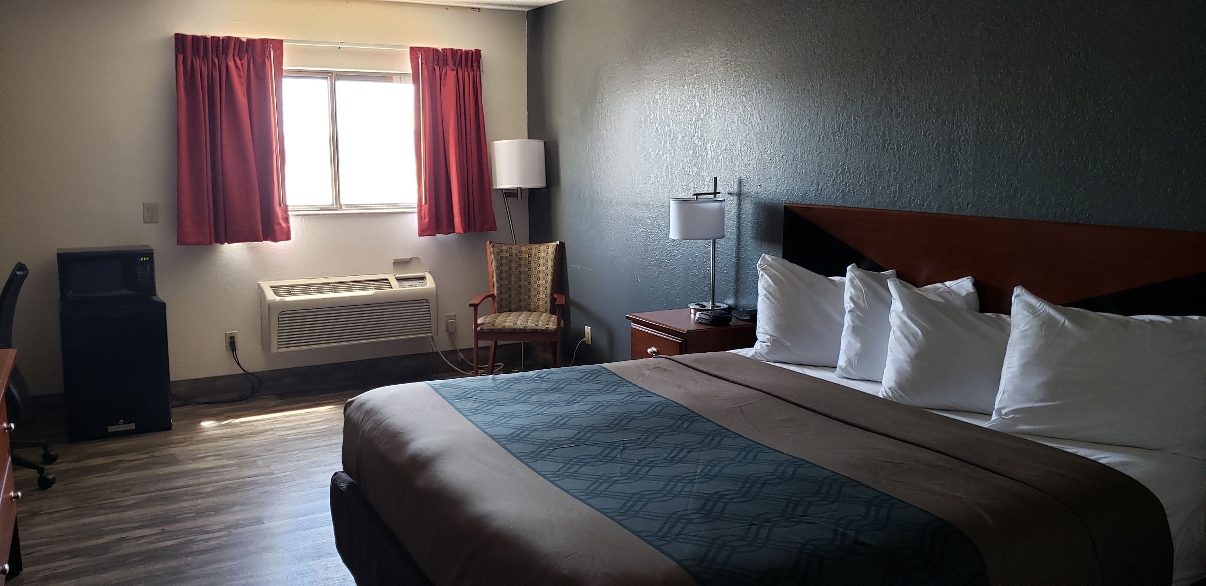 room, 1 king bed, non smoking | desk, blackout curtains, iron/ironing board, free wifi