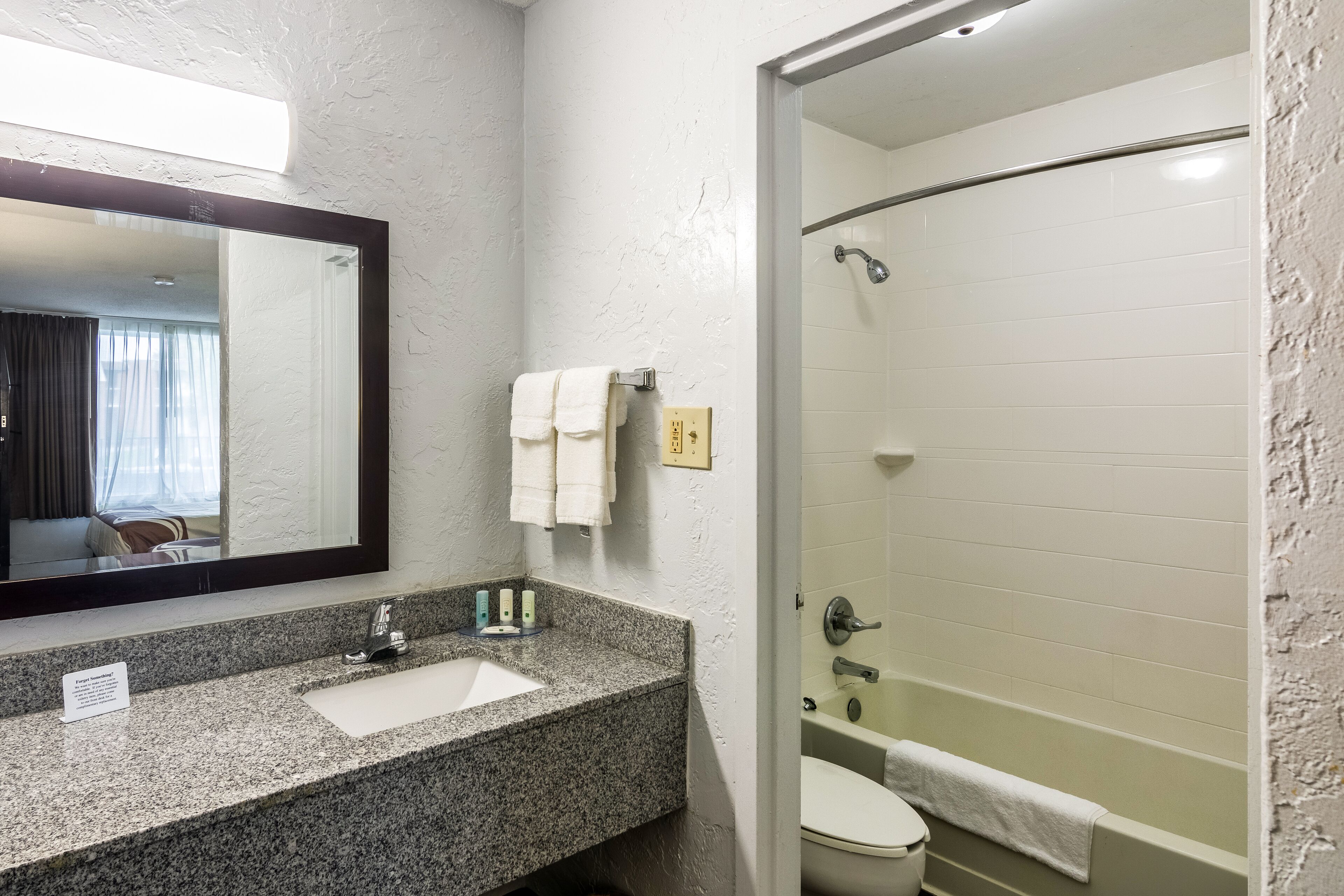 combined shower/bathtub, towels, soap, shampoo