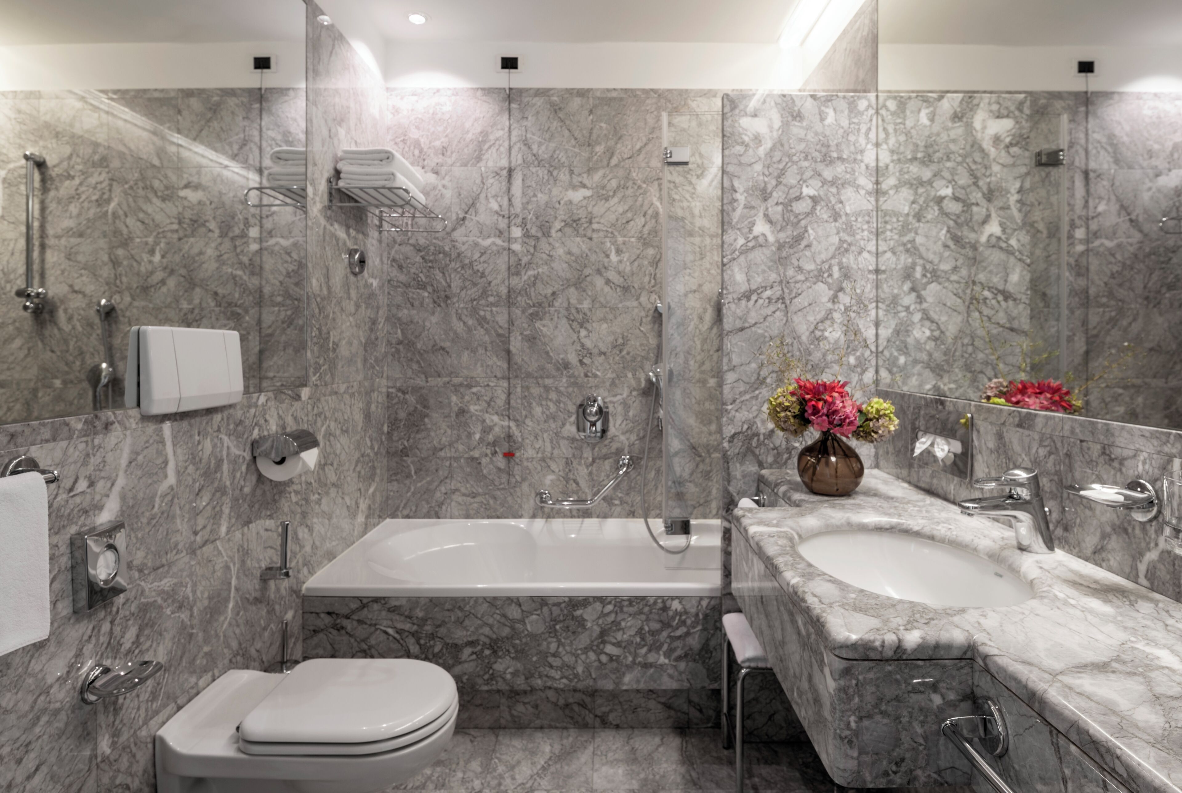 designer toiletries, hair dryer, bathrobes, slippers