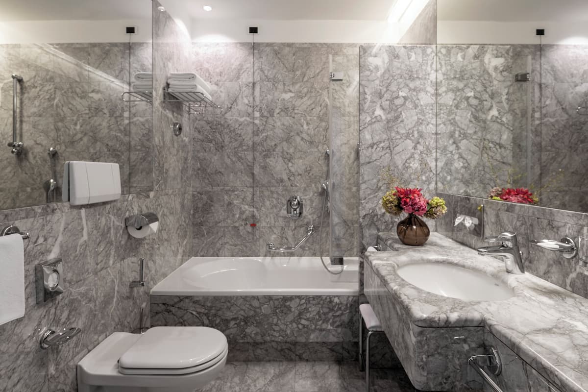 designer toiletries, hair dryer, bathrobes, slippers