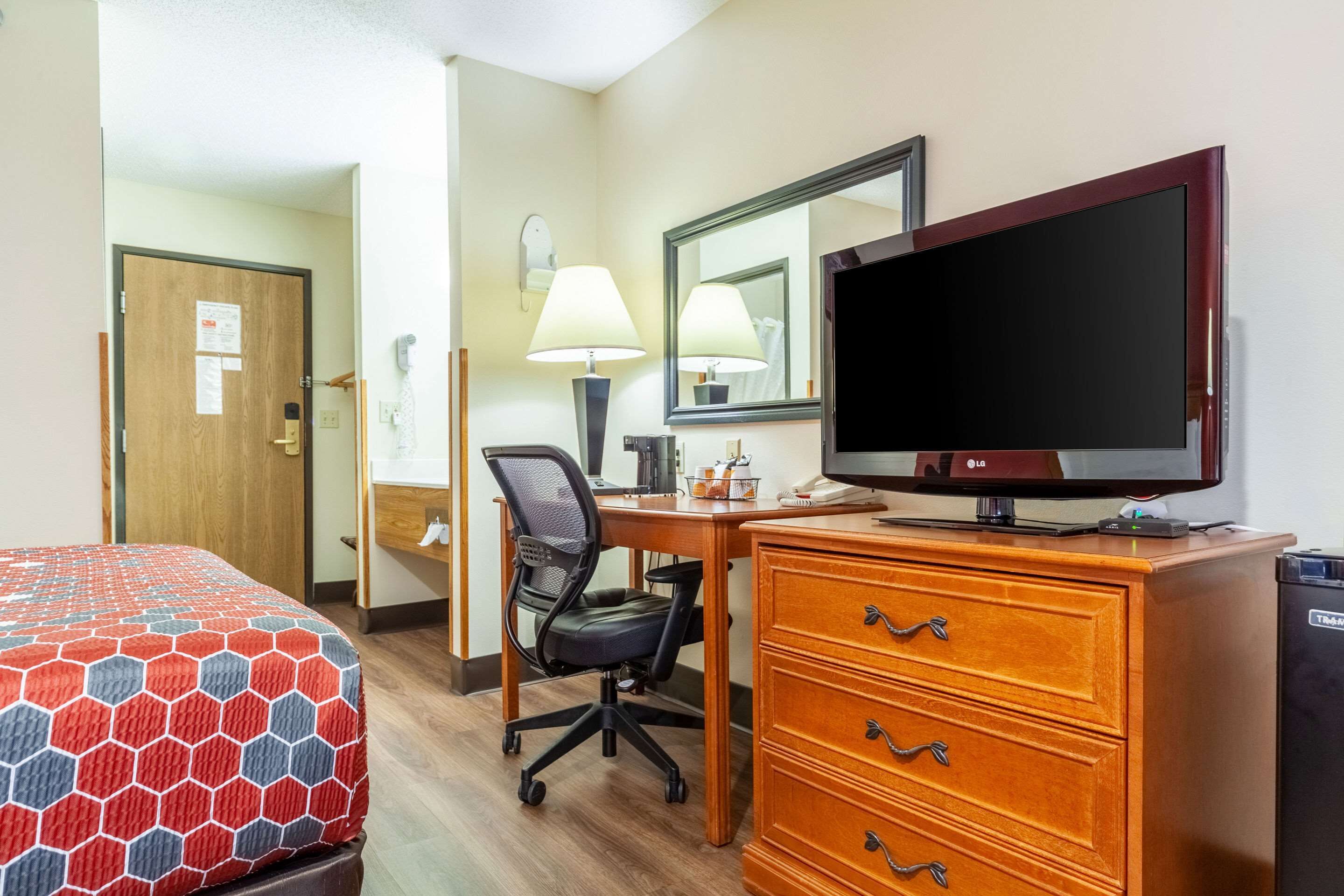 desk, blackout curtains, iron/ironing board, rollaway beds