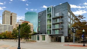 A modern hotel with a prominent sign, large windows, and a well-maintained urban street. - Fairfield Inn & Suites Fort Worth Downtown/Convention Center (Fort Worth)