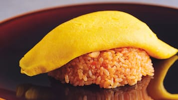 A dish with a yellow top and a brown base, possibly a type of food presentation.