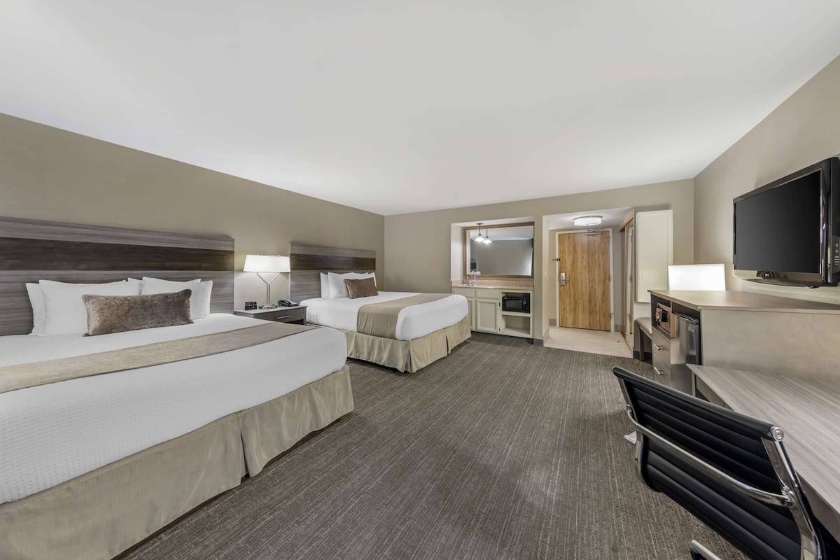 junior suite, multiple beds, non smoking, balcony | premium bedding, blackout curtains, iron/ironing board