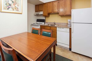 Fridge, microwave, coffee/tea maker, cookware/dishes/utensils