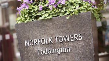 A sign with "NORFOLK TOWERS Paddington" indicating the location.