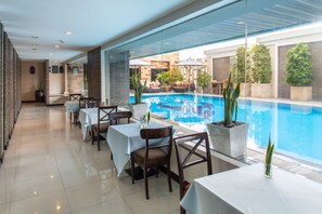 Outdoor pool, open 7:00 AM to 7:00 PM, pool umbrellas, pool loungers