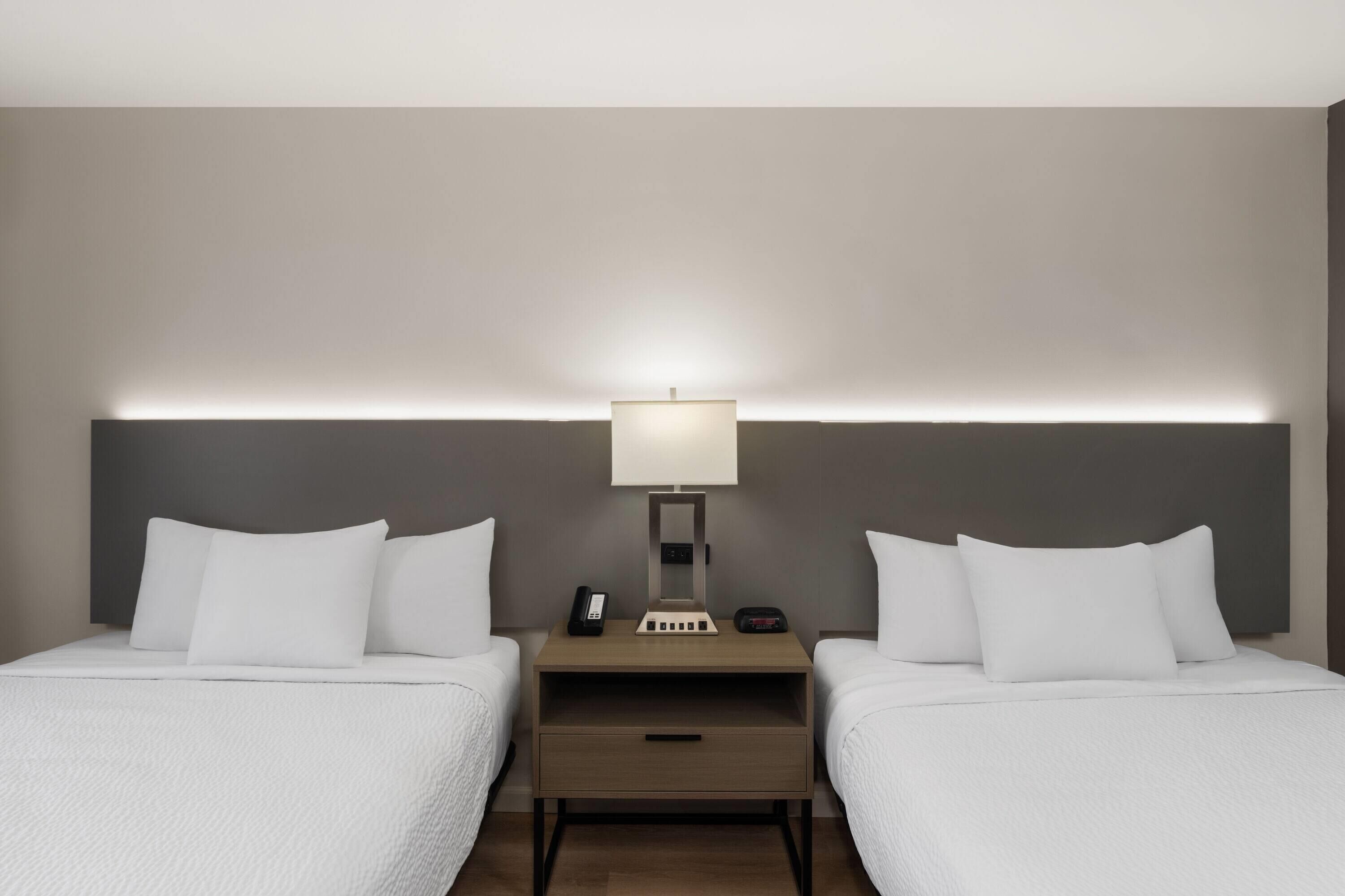 Room, 2 Queen Beds, Mobility Accessible, Non Smoking (Roll-in Shower) | Desk, blackout drapes, iron/ironing board, free cribs/infant beds