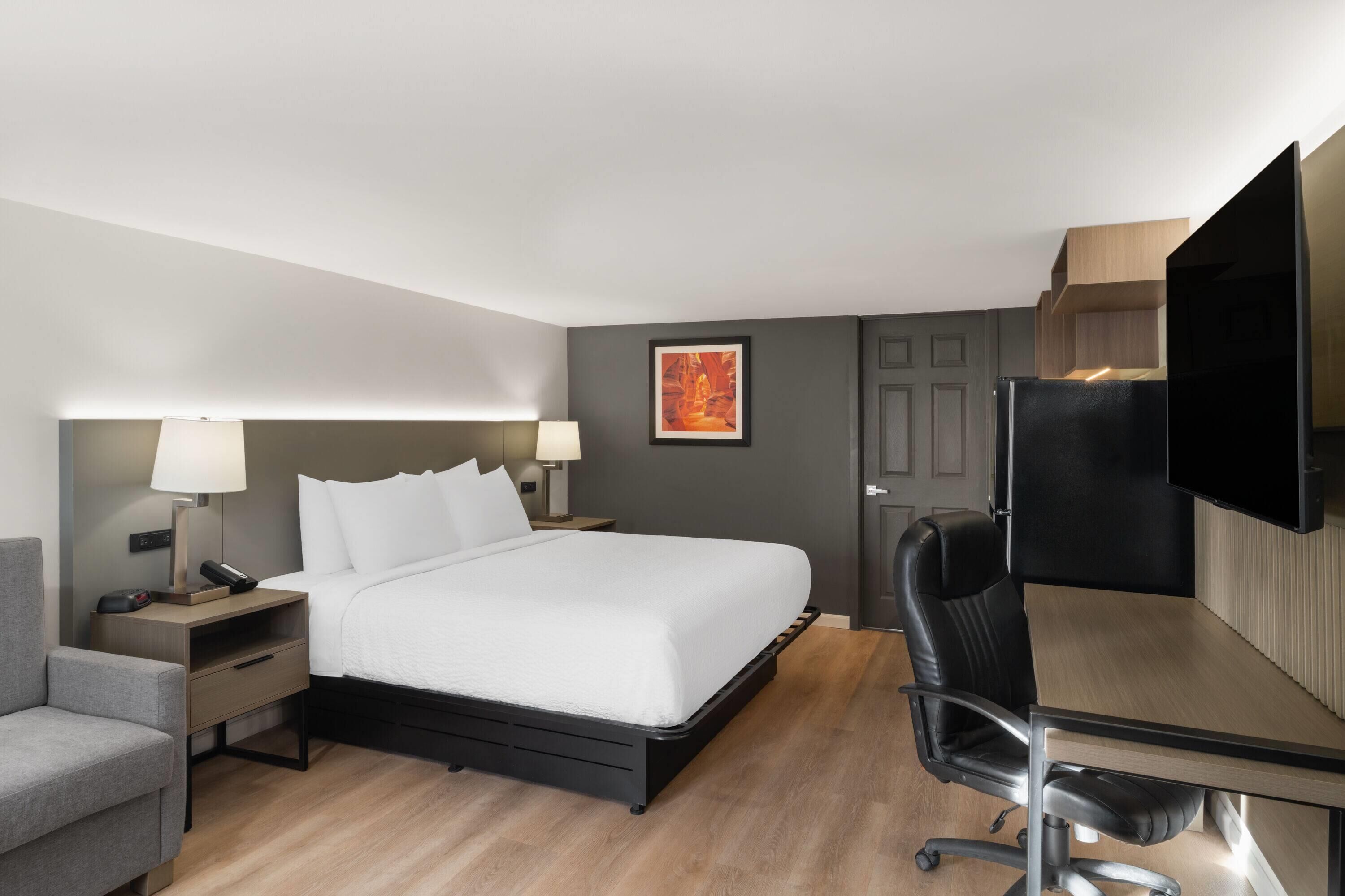 Suite, 1 King Bed, Non Smoking | Desk, blackout drapes, iron/ironing board, free cribs/infant beds