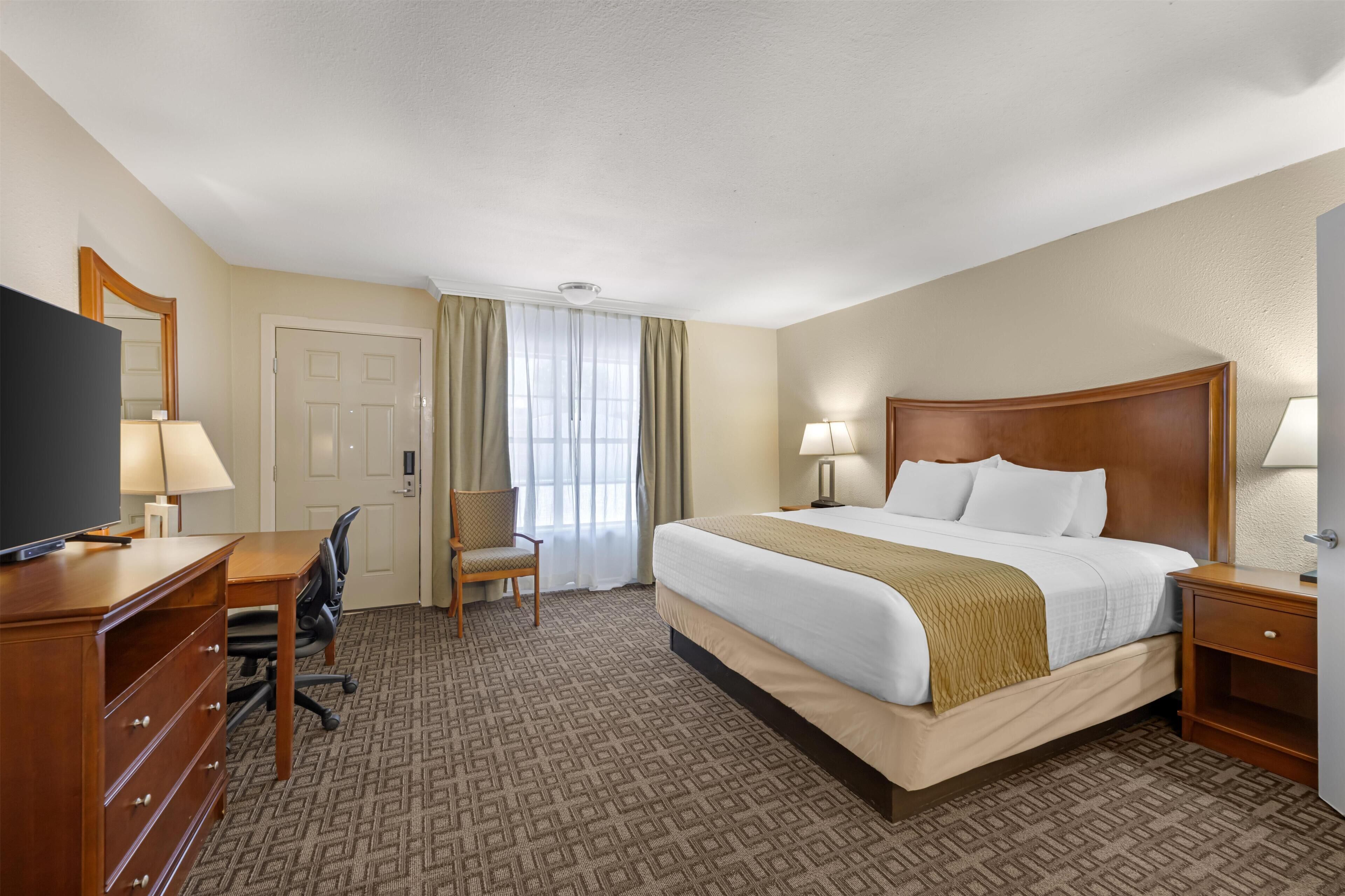 Premium bedding, pillow-top beds, laptop workspace, iron/ironing board