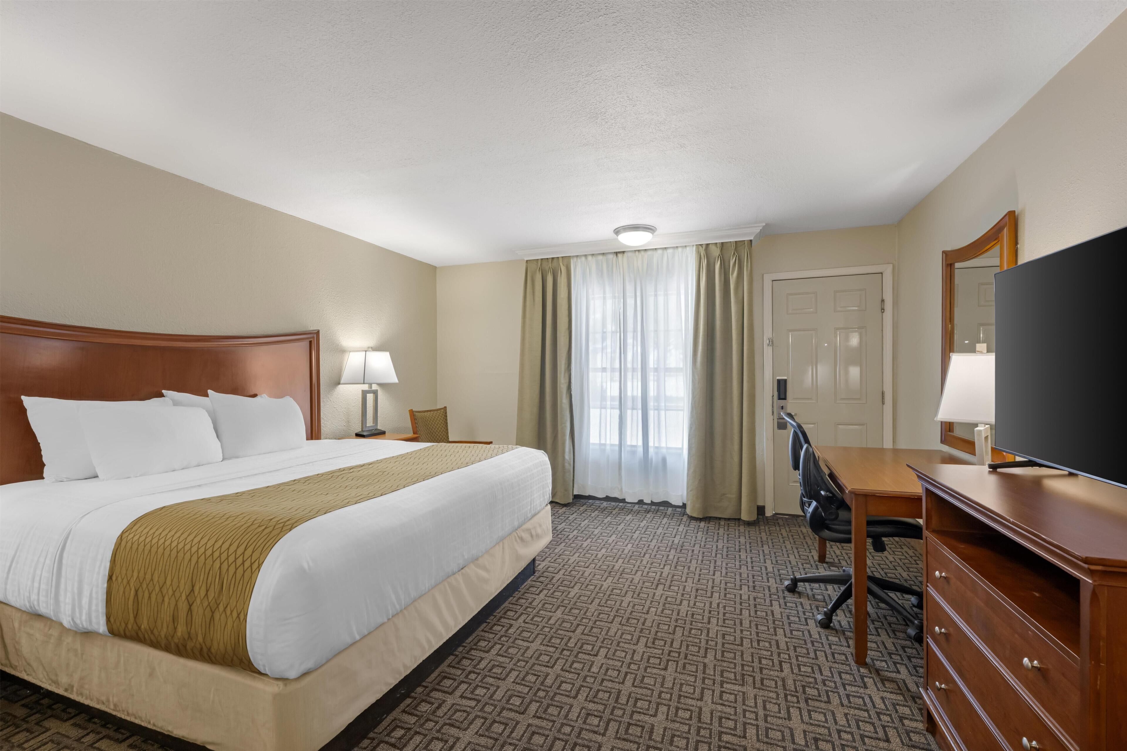 Premium bedding, pillow-top beds, laptop workspace, iron/ironing board