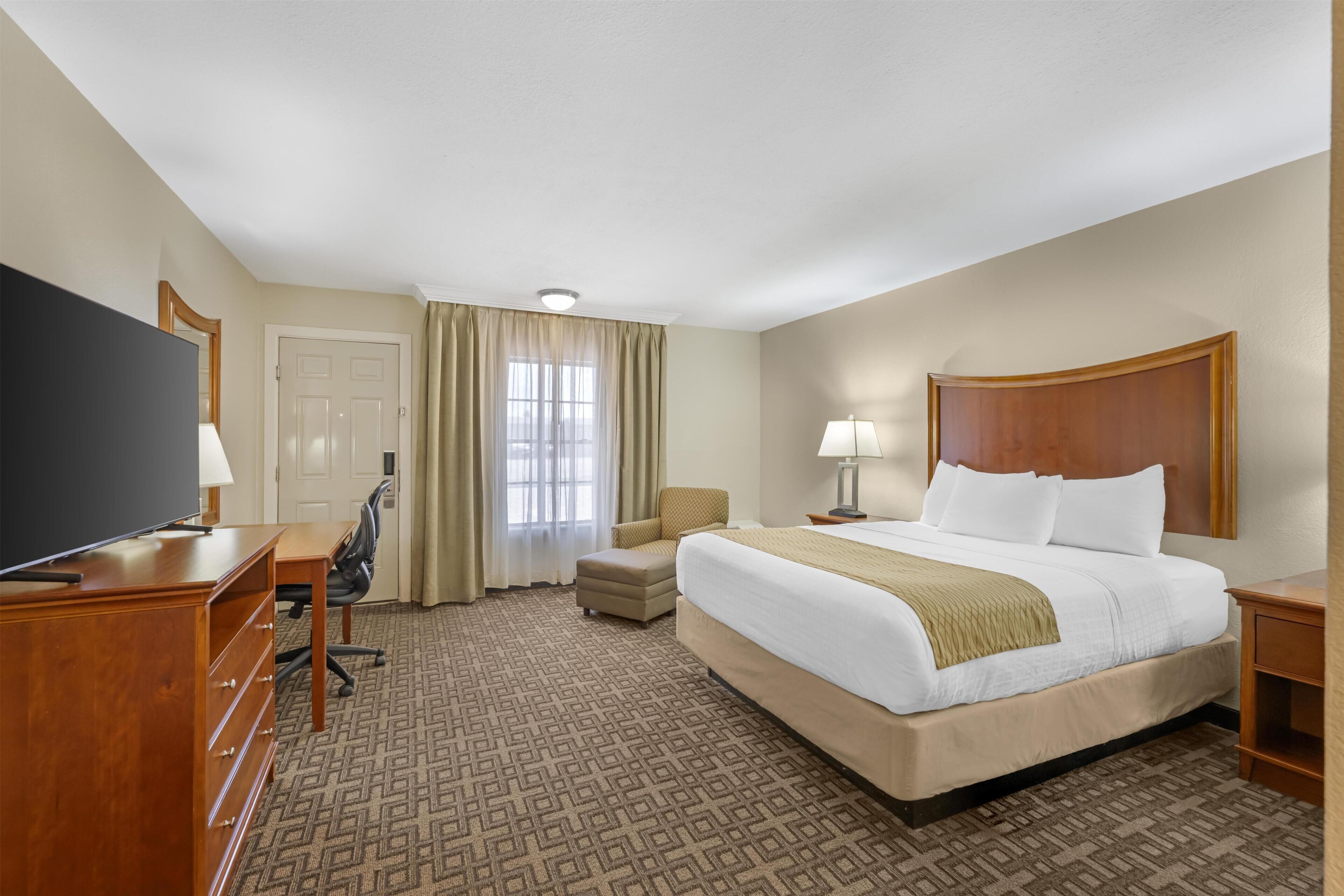 Premium bedding, pillow-top beds, laptop workspace, iron/ironing board