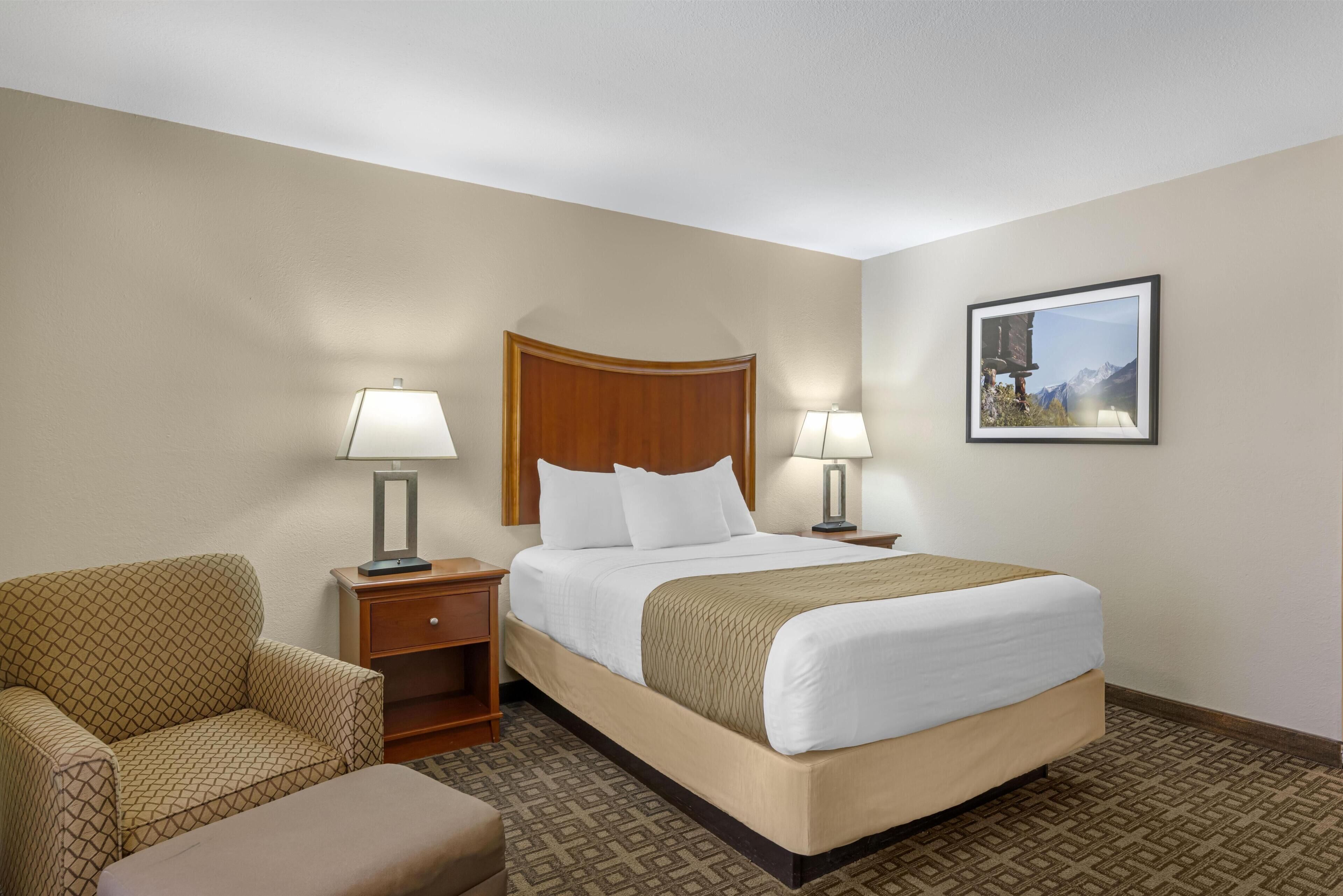 Premium bedding, pillow-top beds, laptop workspace, iron/ironing board