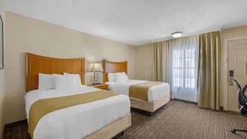 Premium bedding, pillow-top beds, laptop workspace, iron/ironing board