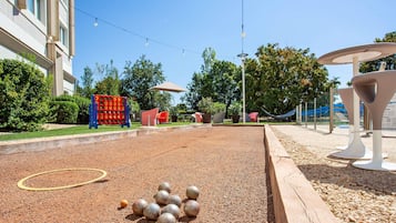 Seasonal outdoor pool, open 8:00 AM to 9:00 PM, pool umbrellas
