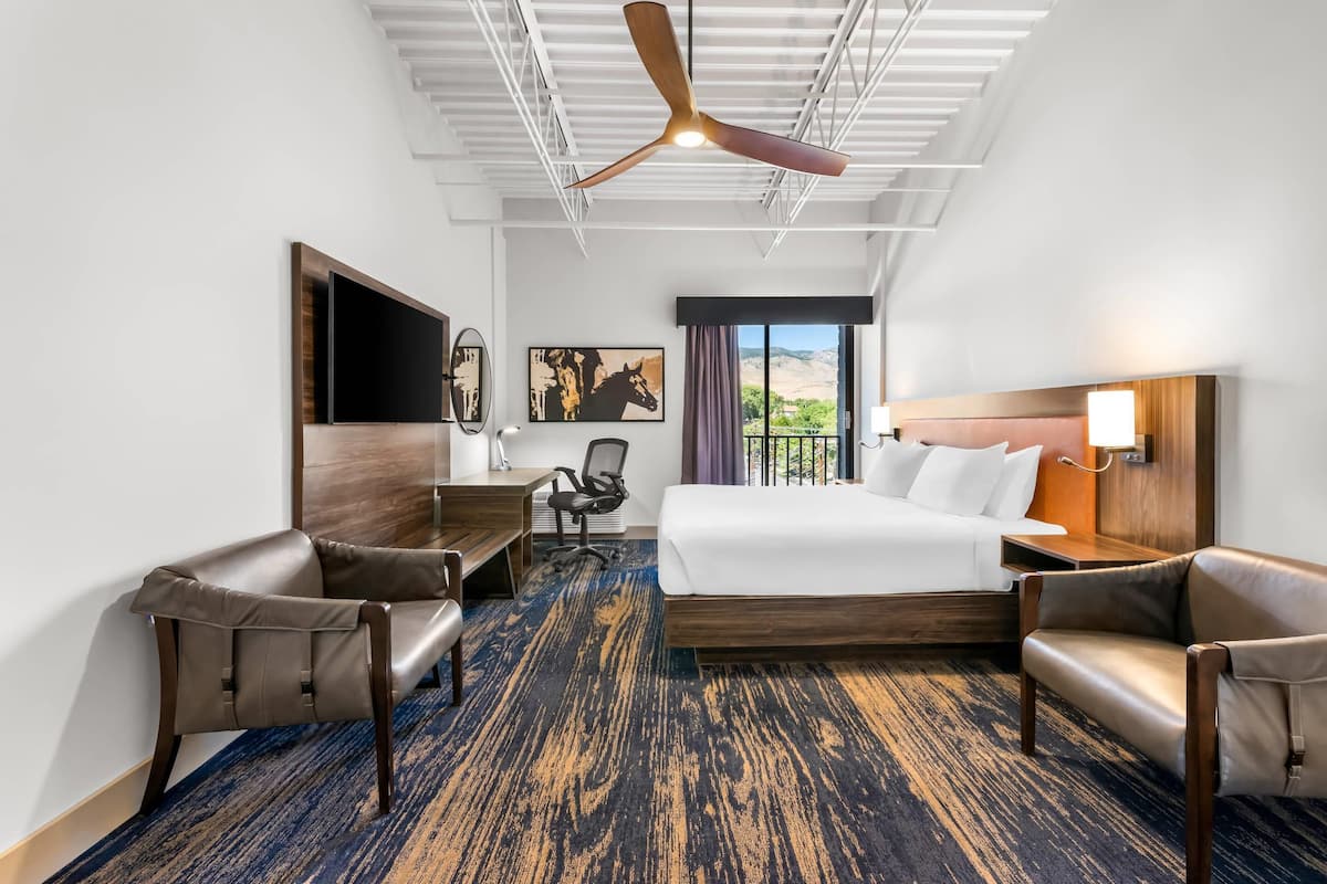 Hypo-allergenic bedding, desk, laptop workspace, blackout curtains