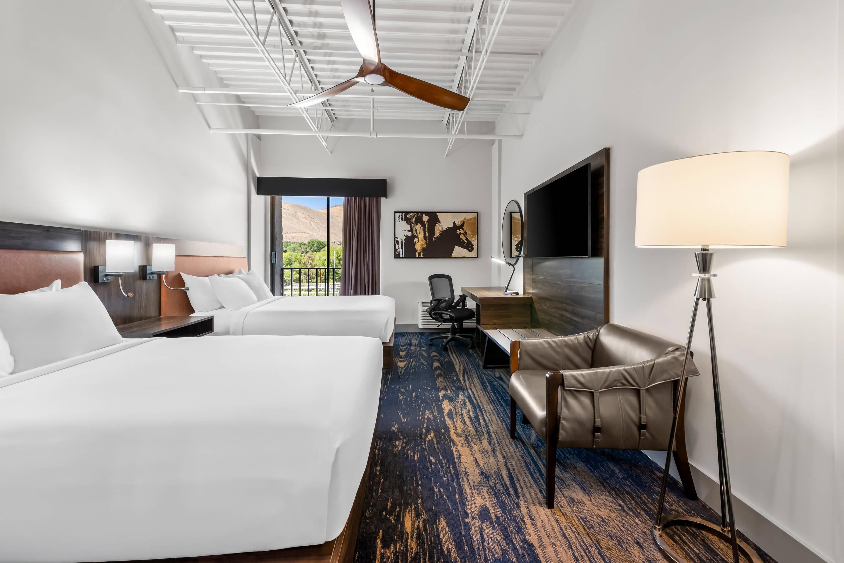 Hypo-allergenic bedding, desk, laptop workspace, blackout curtains