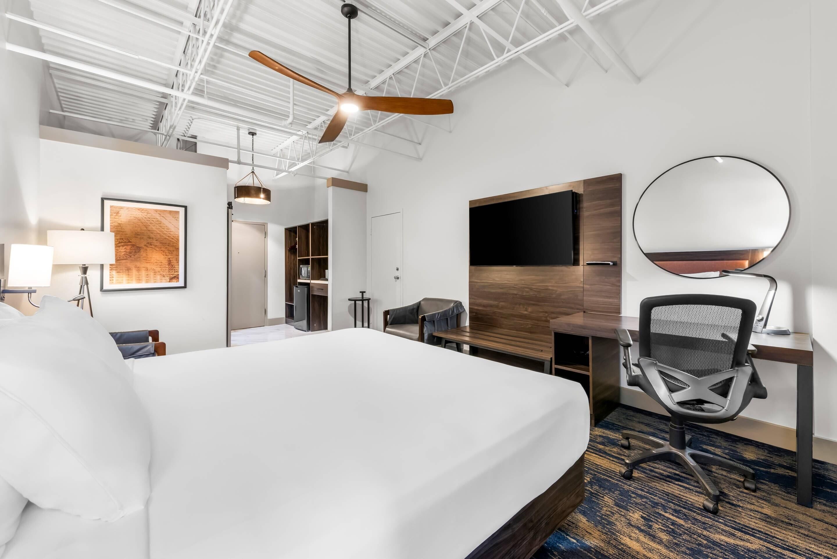 Hypo-allergenic bedding, desk, laptop workspace, blackout curtains