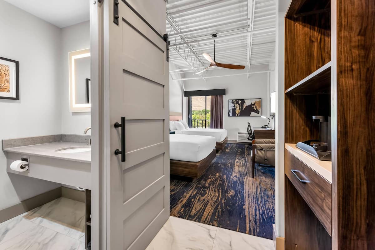 Hypo-allergenic bedding, desk, laptop workspace, blackout curtains