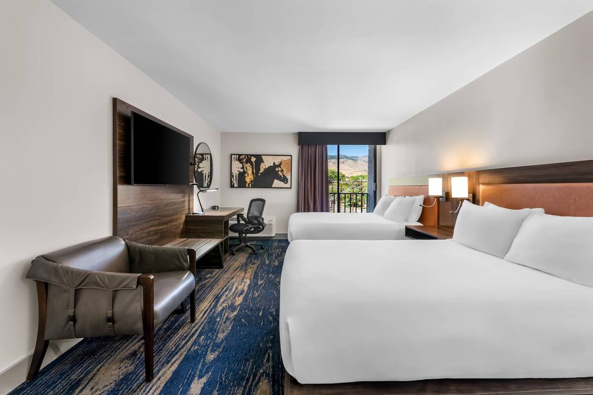 Hypo-allergenic bedding, desk, laptop workspace, blackout curtains