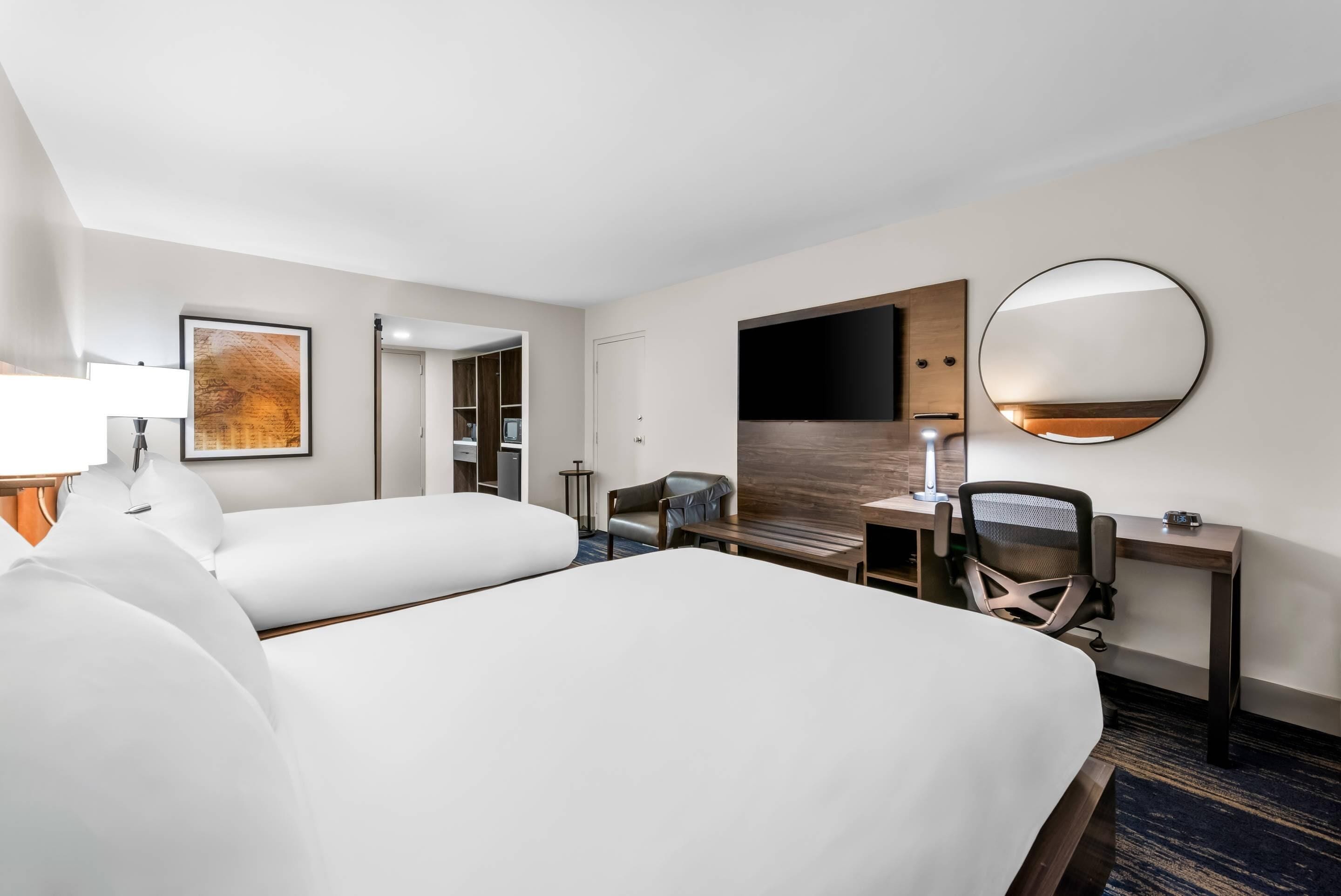 Hypo-allergenic bedding, desk, laptop workspace, blackout curtains