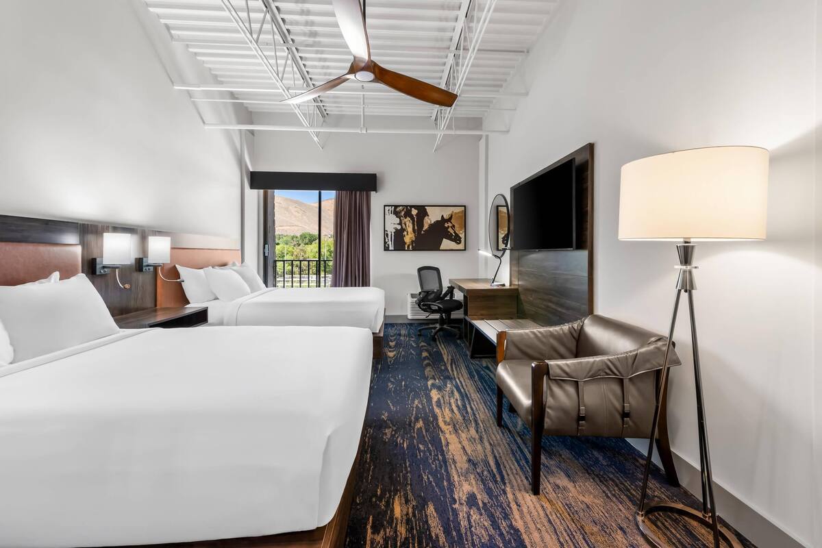 Hypo-allergenic bedding, desk, laptop workspace, blackout curtains