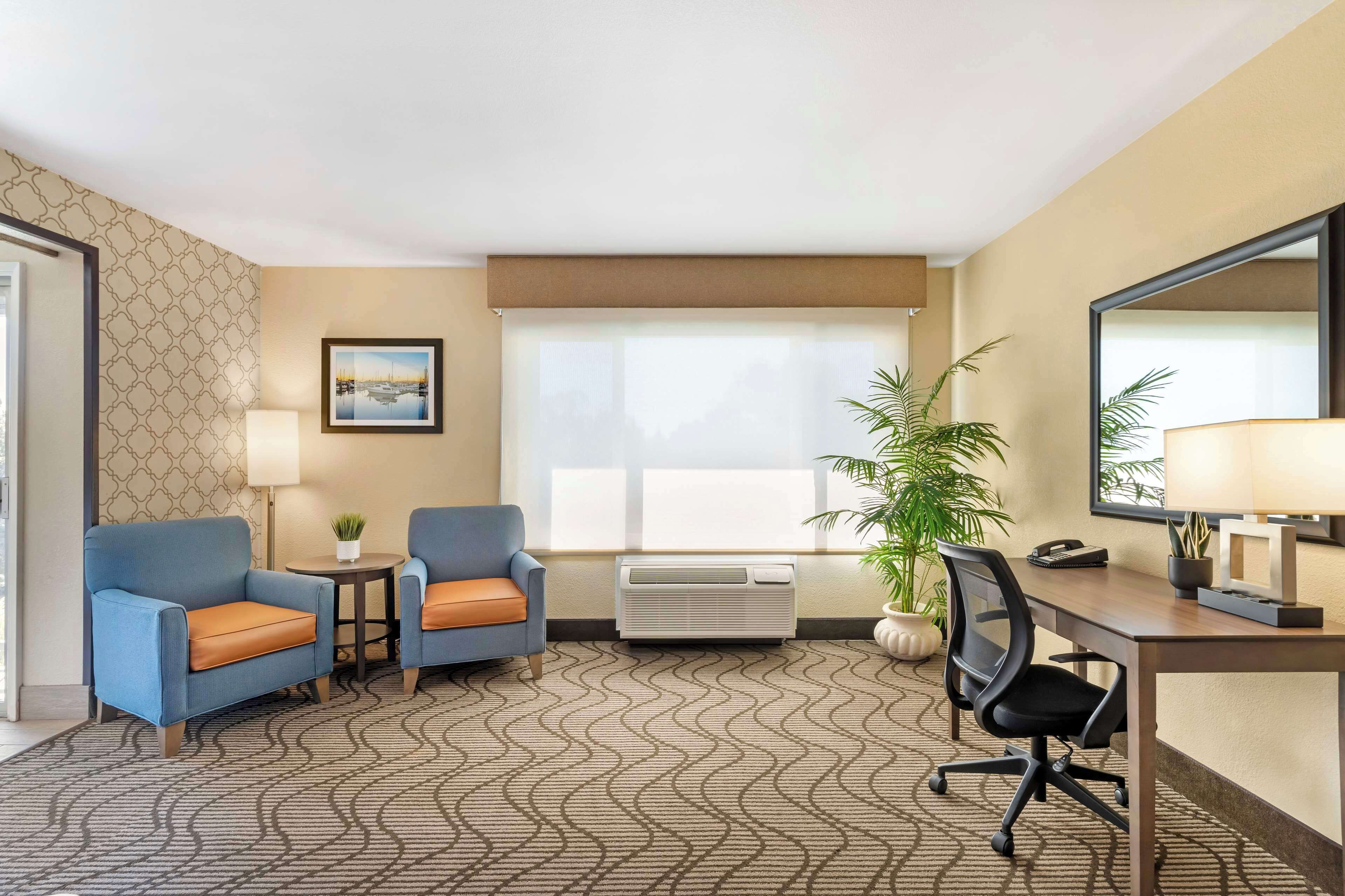 suite, 1 king bed, non smoking, balcony | premium bedding, desk, blackout curtains, iron/ironing board