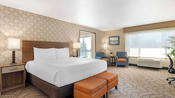 Suite, 1 King Bed, Non Smoking, Balcony | Premium bedding, desk, blackout curtains, iron/ironing board