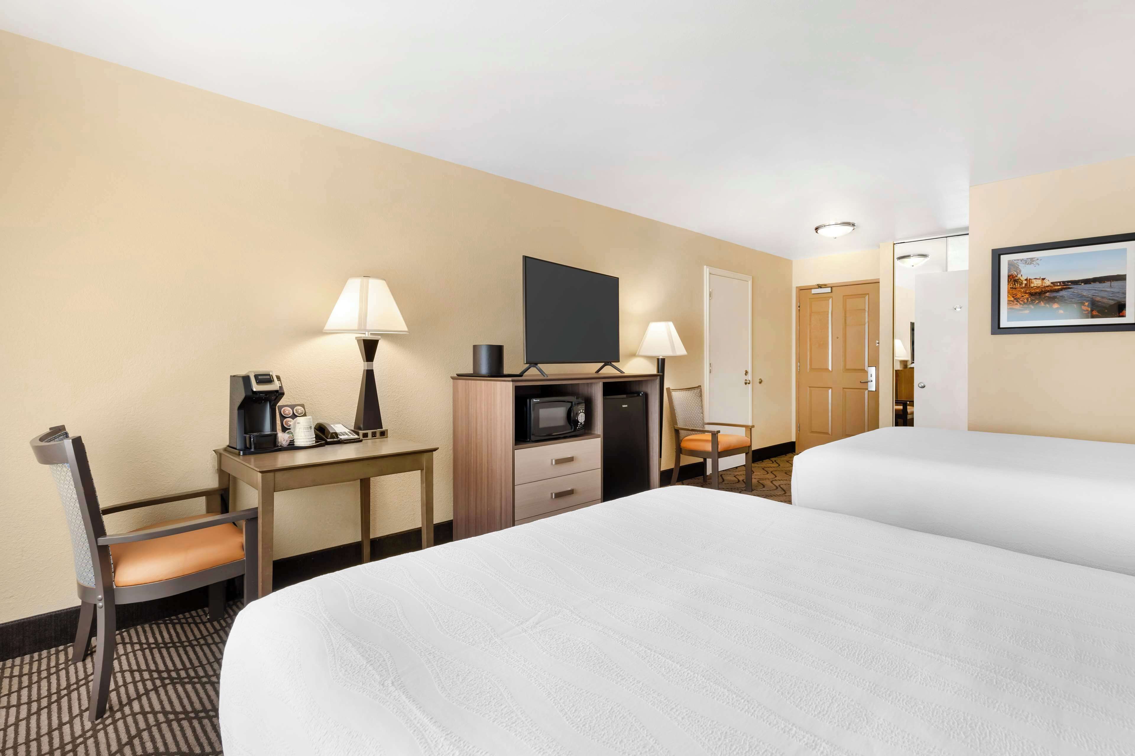 premium bedding, desk, blackout curtains, iron/ironing board