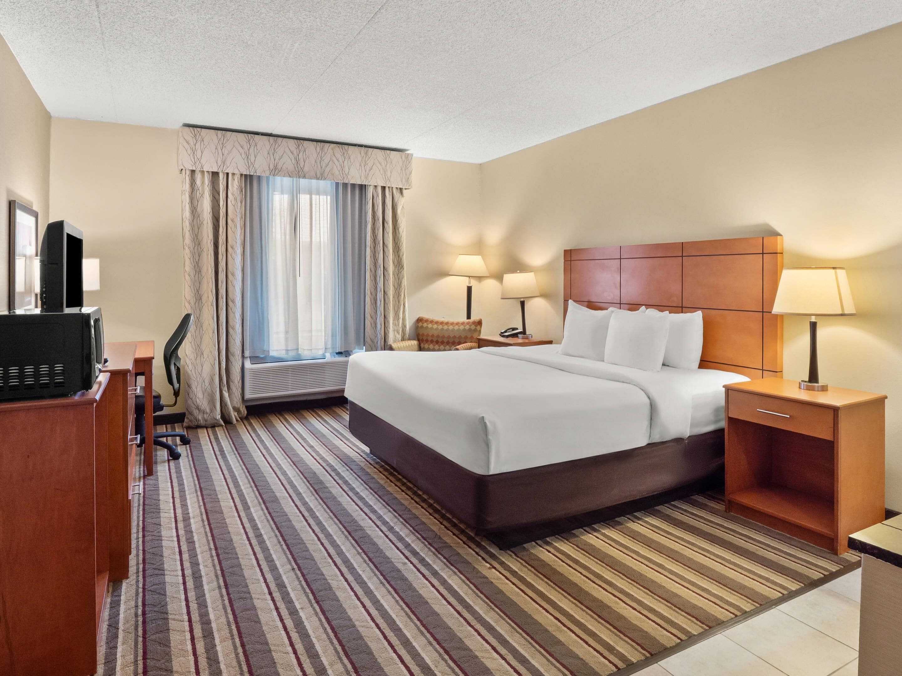 Premium bedding, laptop workspace, blackout drapes, iron/ironing board