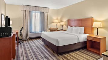 Premium bedding, laptop workspace, blackout drapes, iron/ironing board