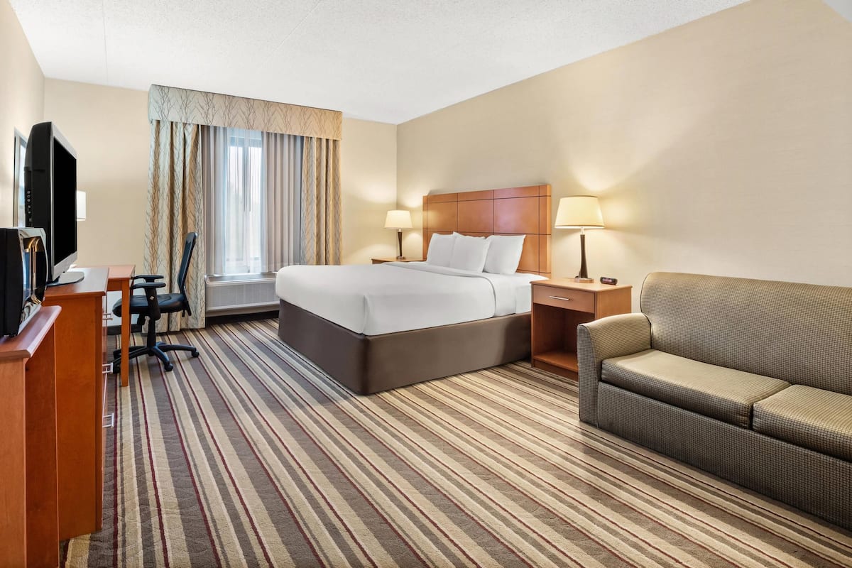 Premium bedding, laptop workspace, blackout curtains, iron/ironing board