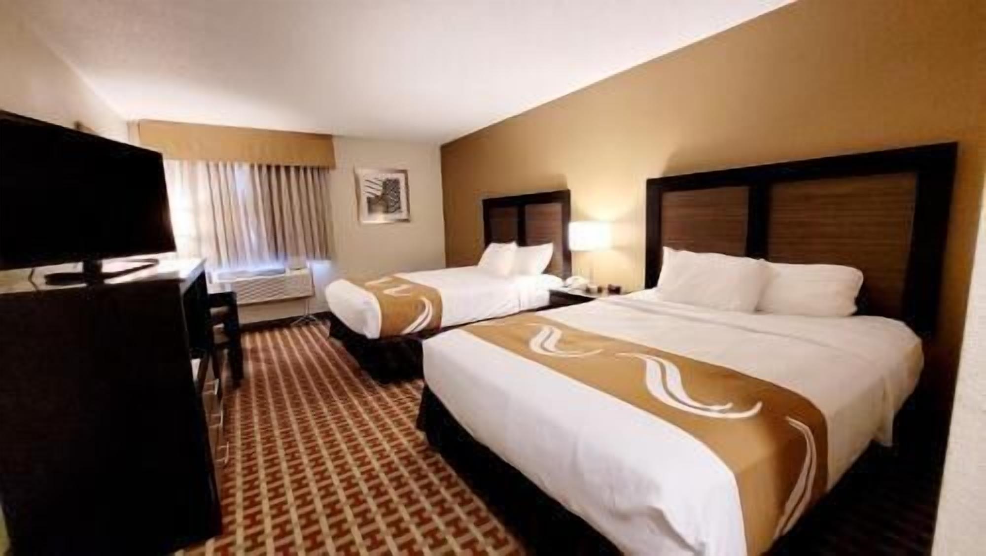 Premium bedding, blackout drapes, soundproofing, iron/ironing board