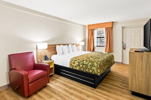 Premium bedding, desk, laptop workspace, blackout drapes