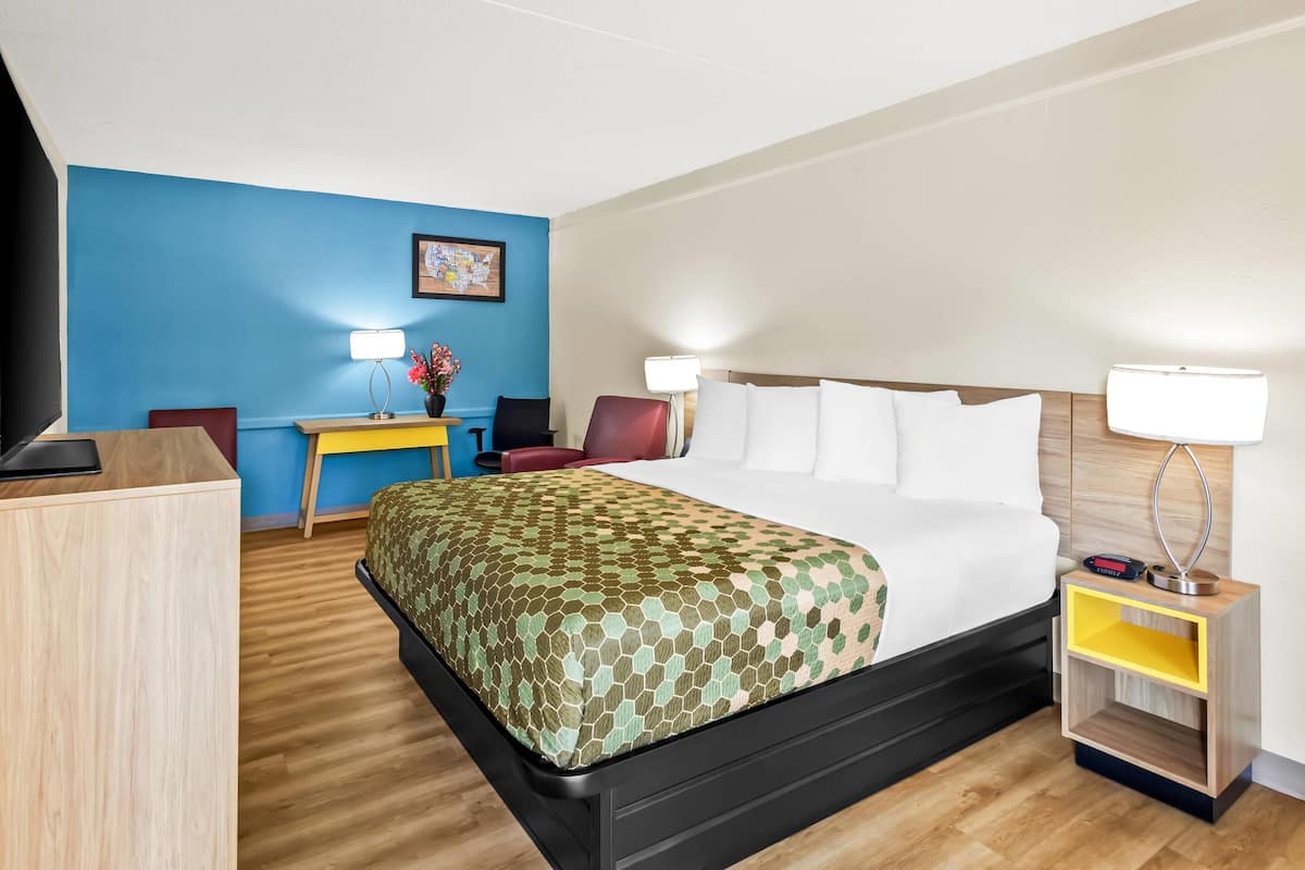 Premium bedding, desk, laptop workspace, blackout curtains