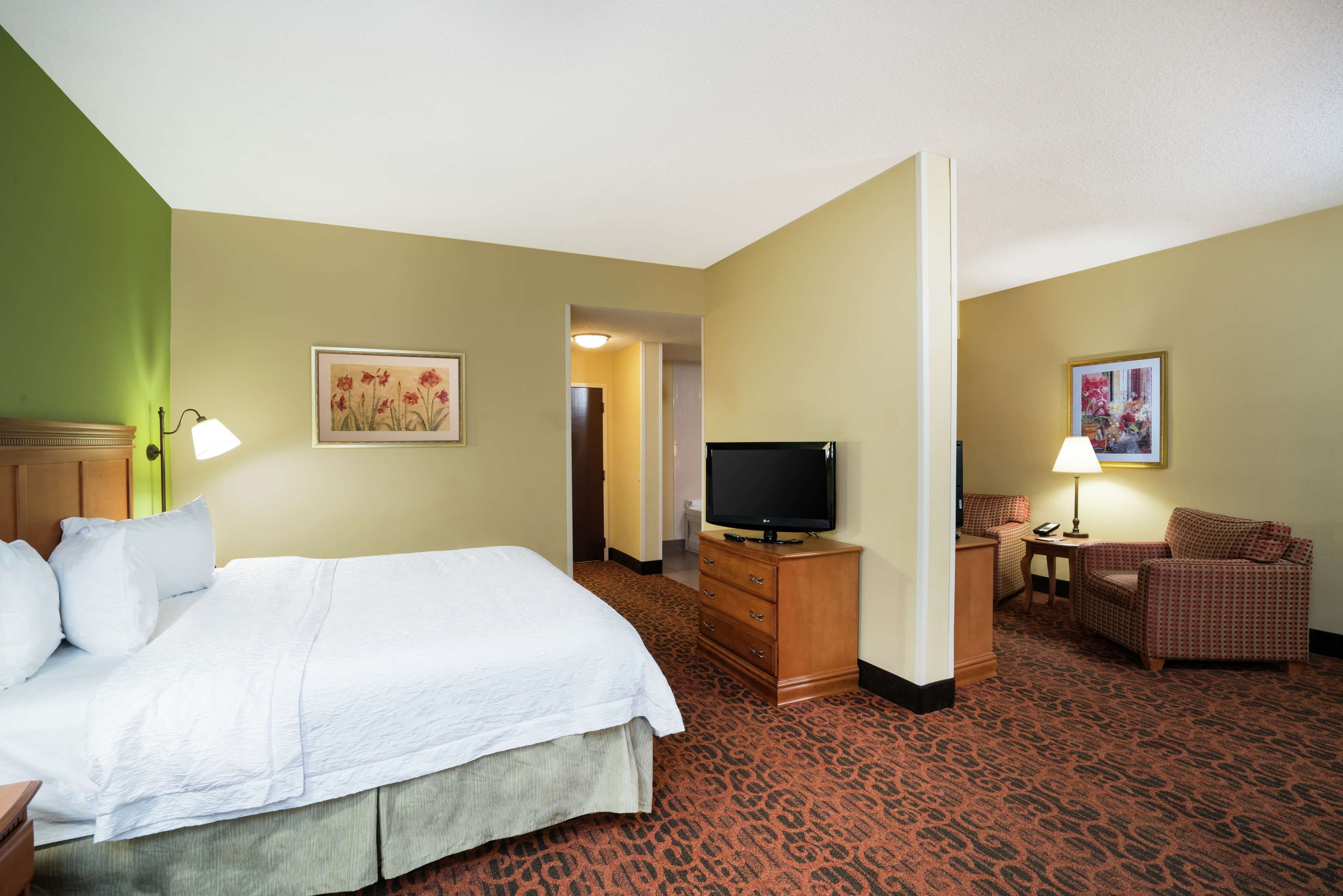 suite, 1 king bed, non smoking | in-room safe, iron/ironing board, free cots/infant beds, rollaway beds