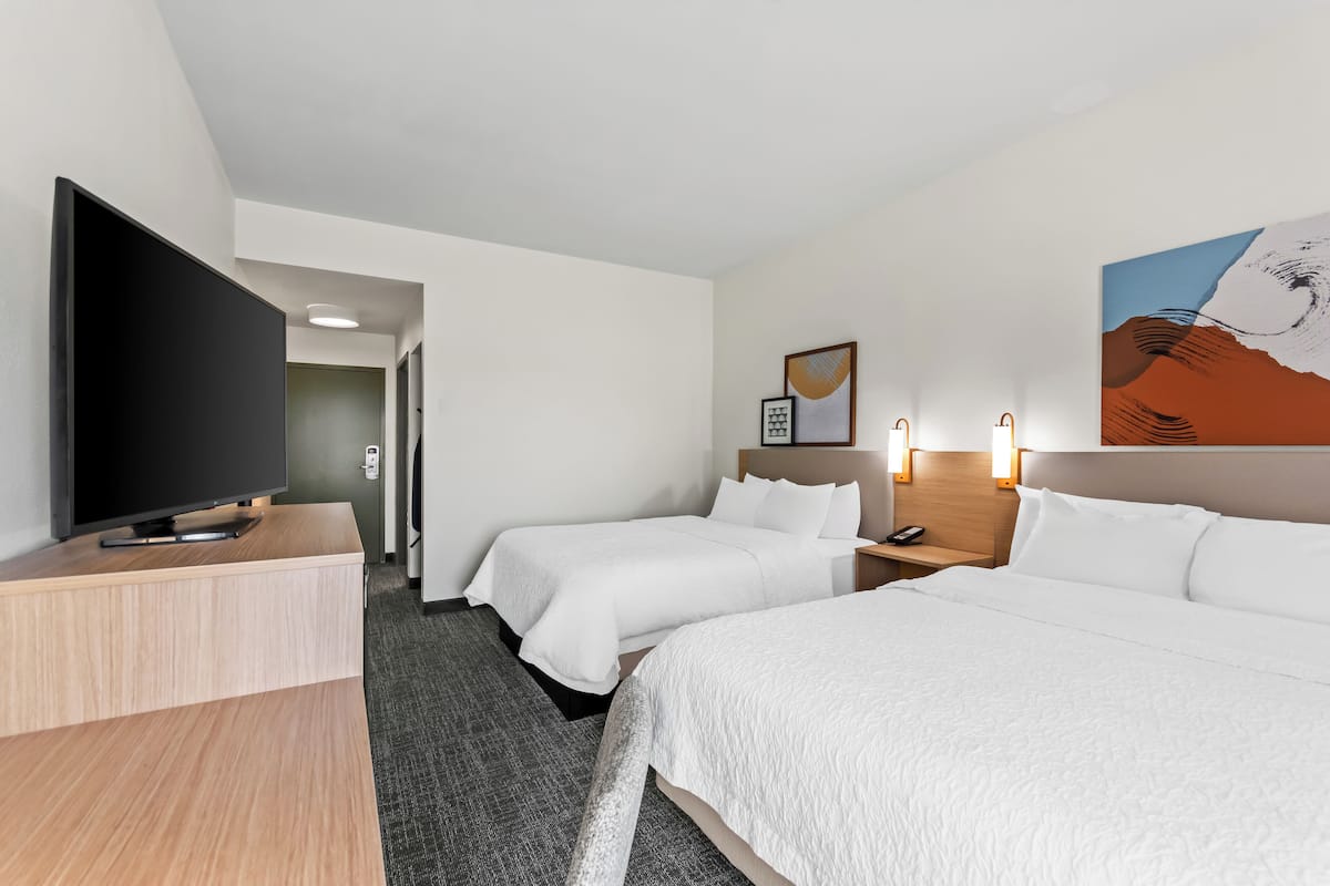 Premium bedding, desk, laptop workspace, iron/ironing board