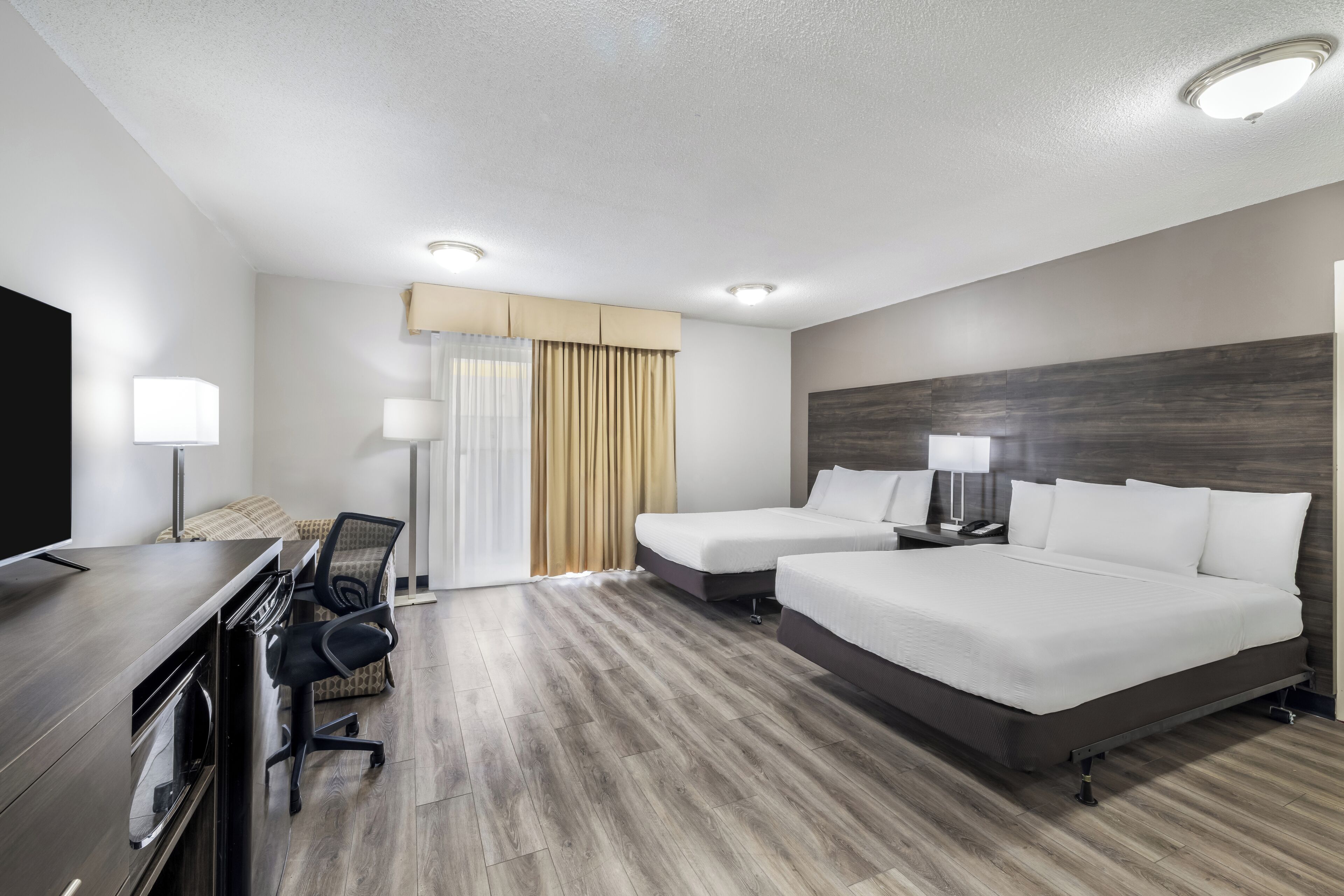 Family Room, 2 Double Beds, Non Smoking | Premium bedding, in-room safe, desk, blackout drapes