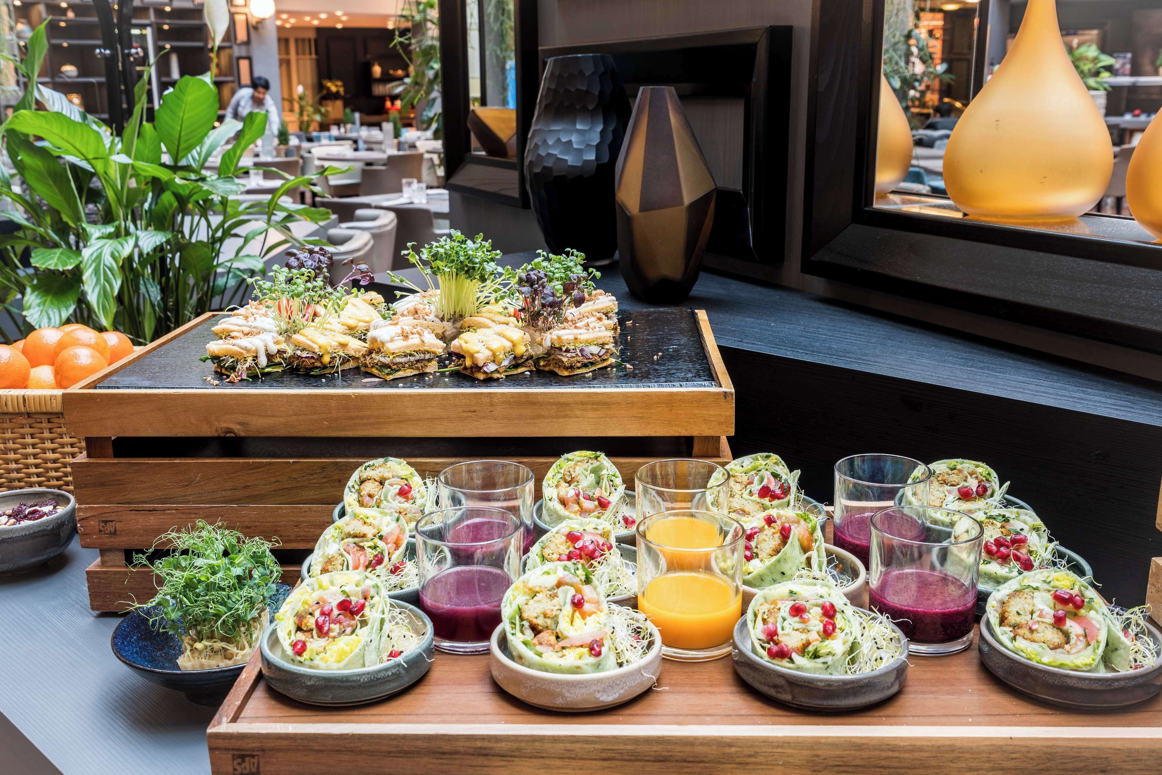 A buffet with various dishes and drinks.