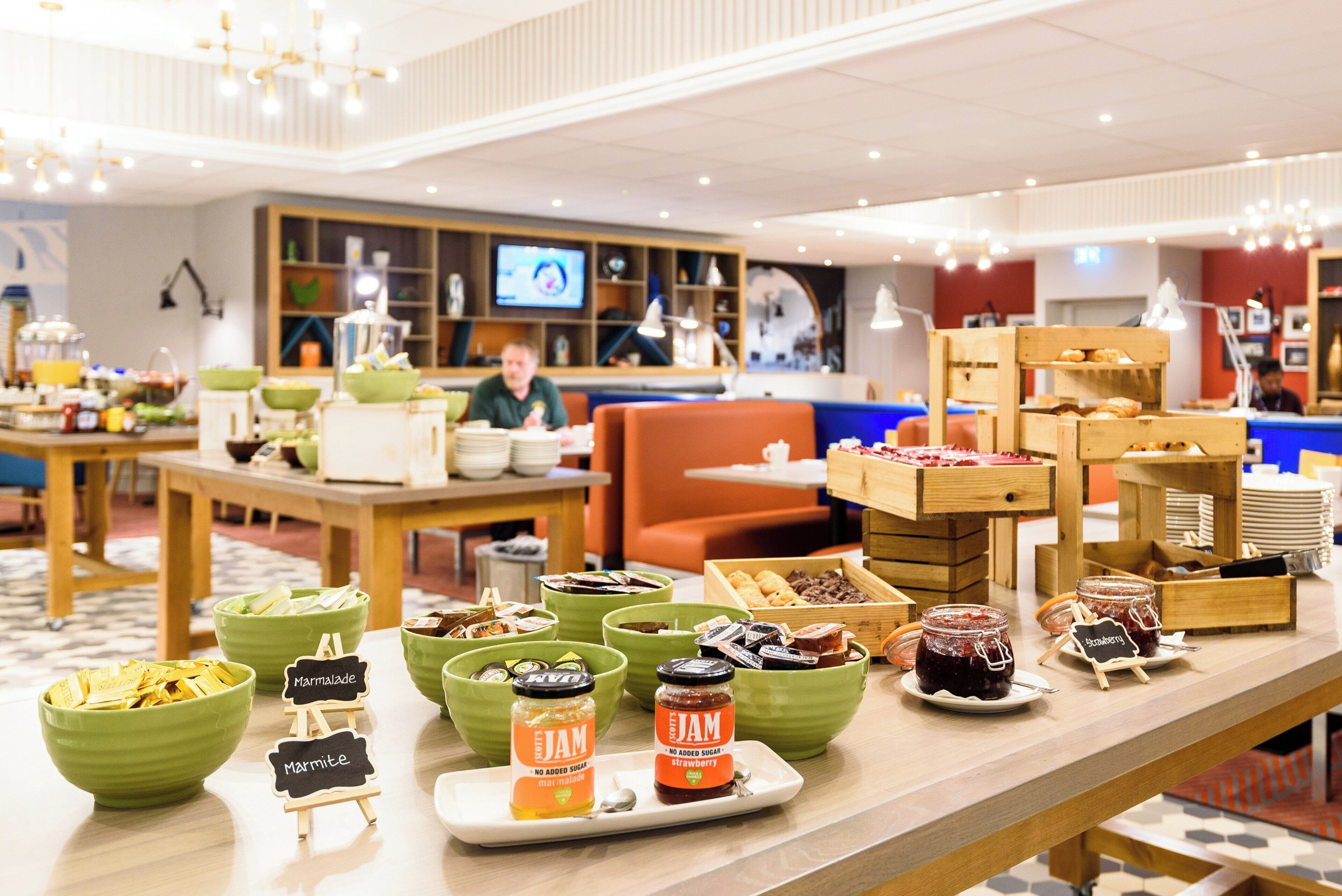 A buffet with various food items and condiments.