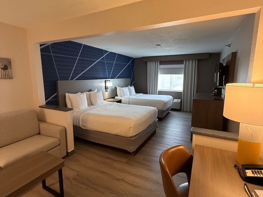 Suite, Multiple Beds, Non Smoking | Desk, laptop workspace, blackout curtains, iron/ironing board