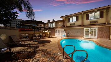 Outdoor pool, open 7:00 AM to 10:00 PM, pool umbrellas, sun loungers