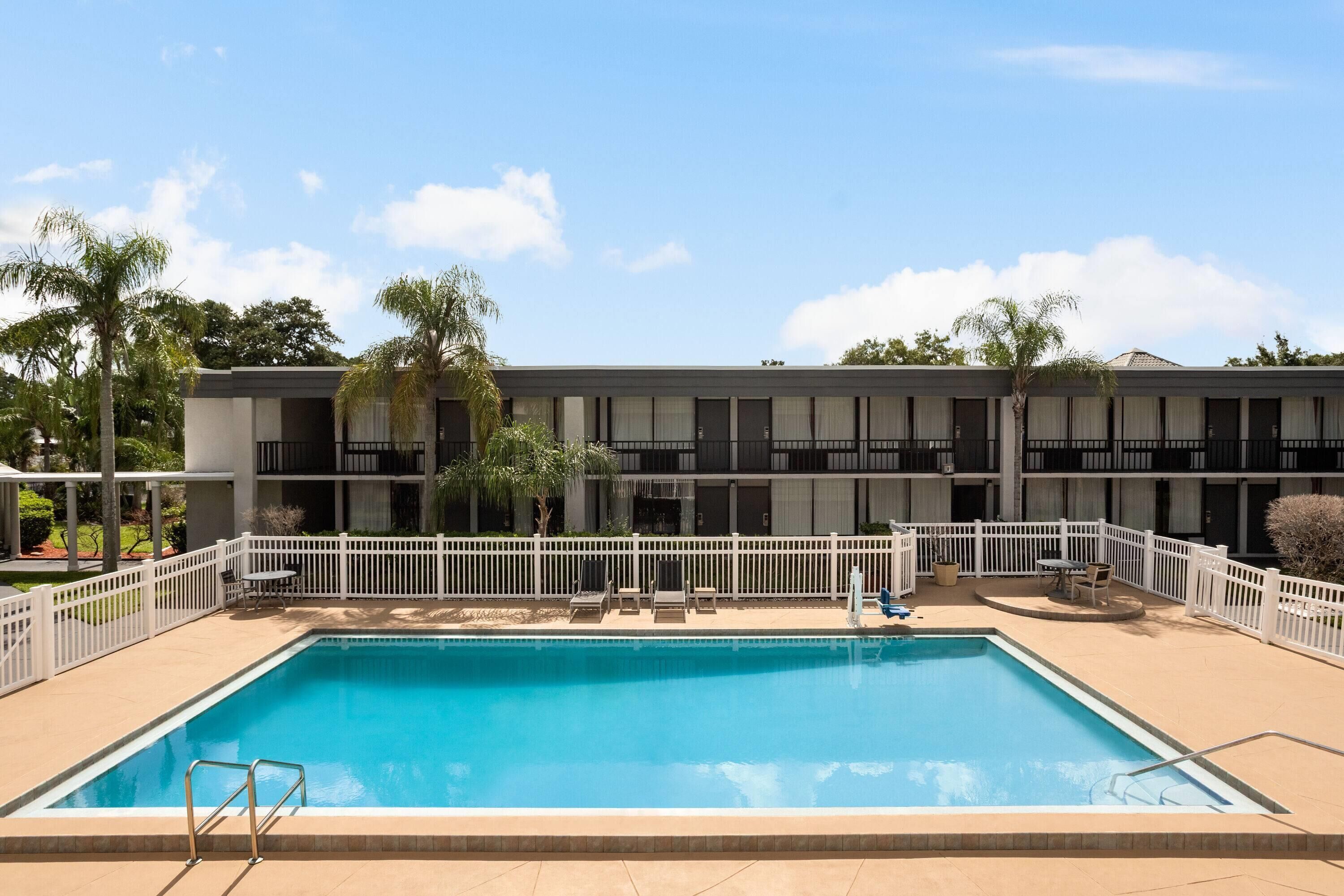 Outdoor pool, open 6 AM to 8:00 PM, pool umbrellas, pool loungers