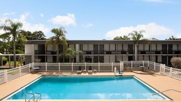 Outdoor pool, open 6 AM to 8:00 PM, pool umbrellas, pool loungers