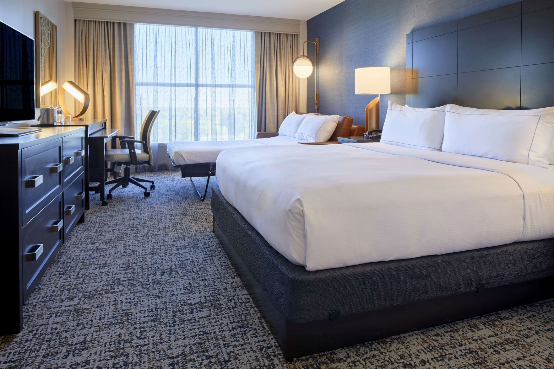 Premium bedding, down duvets, in-room safe, desk
