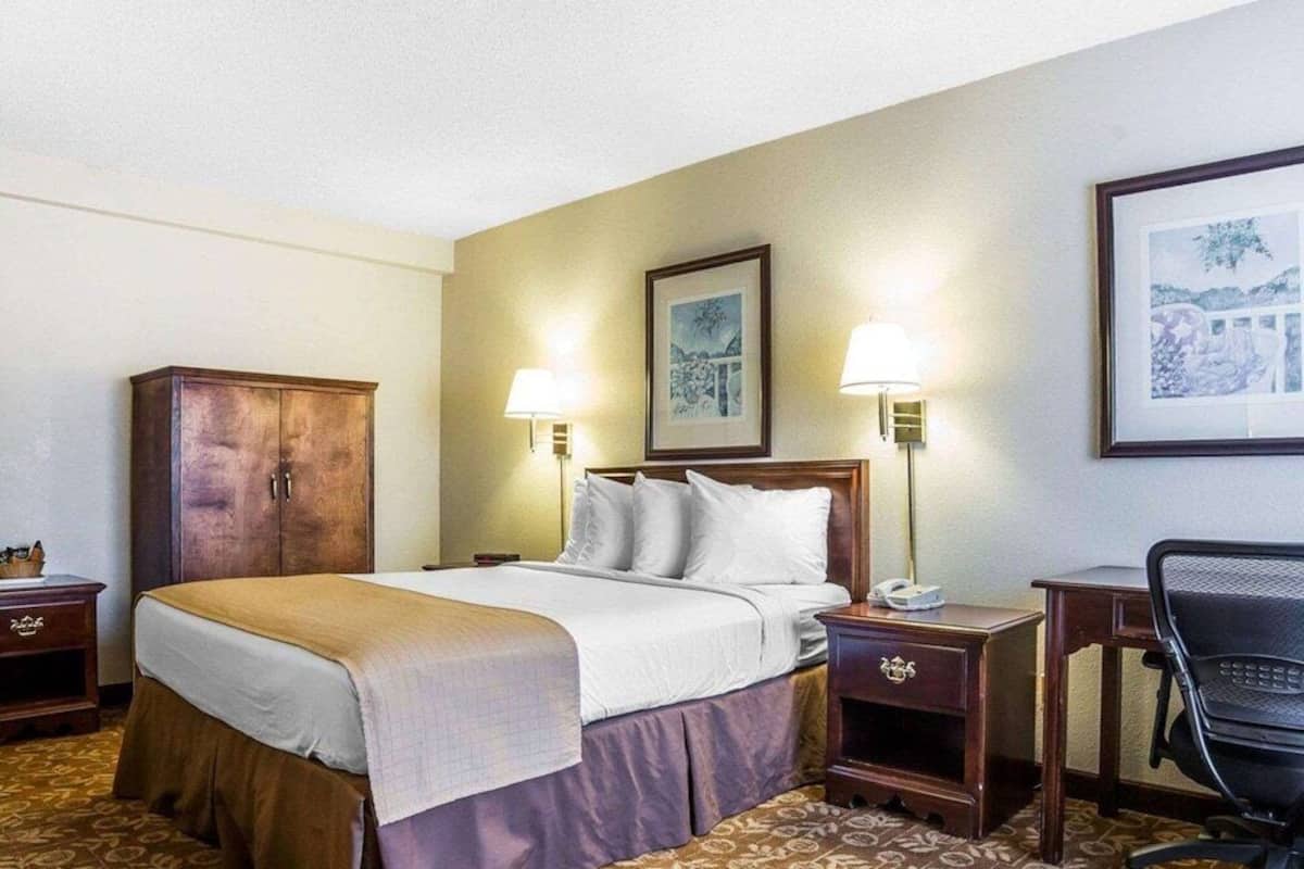 Pillowtop beds, desk, blackout drapes, iron/ironing board
