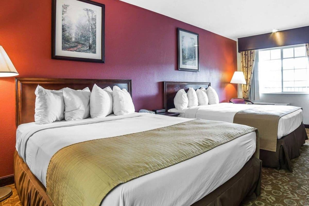 Pillowtop beds, desk, blackout drapes, iron/ironing board