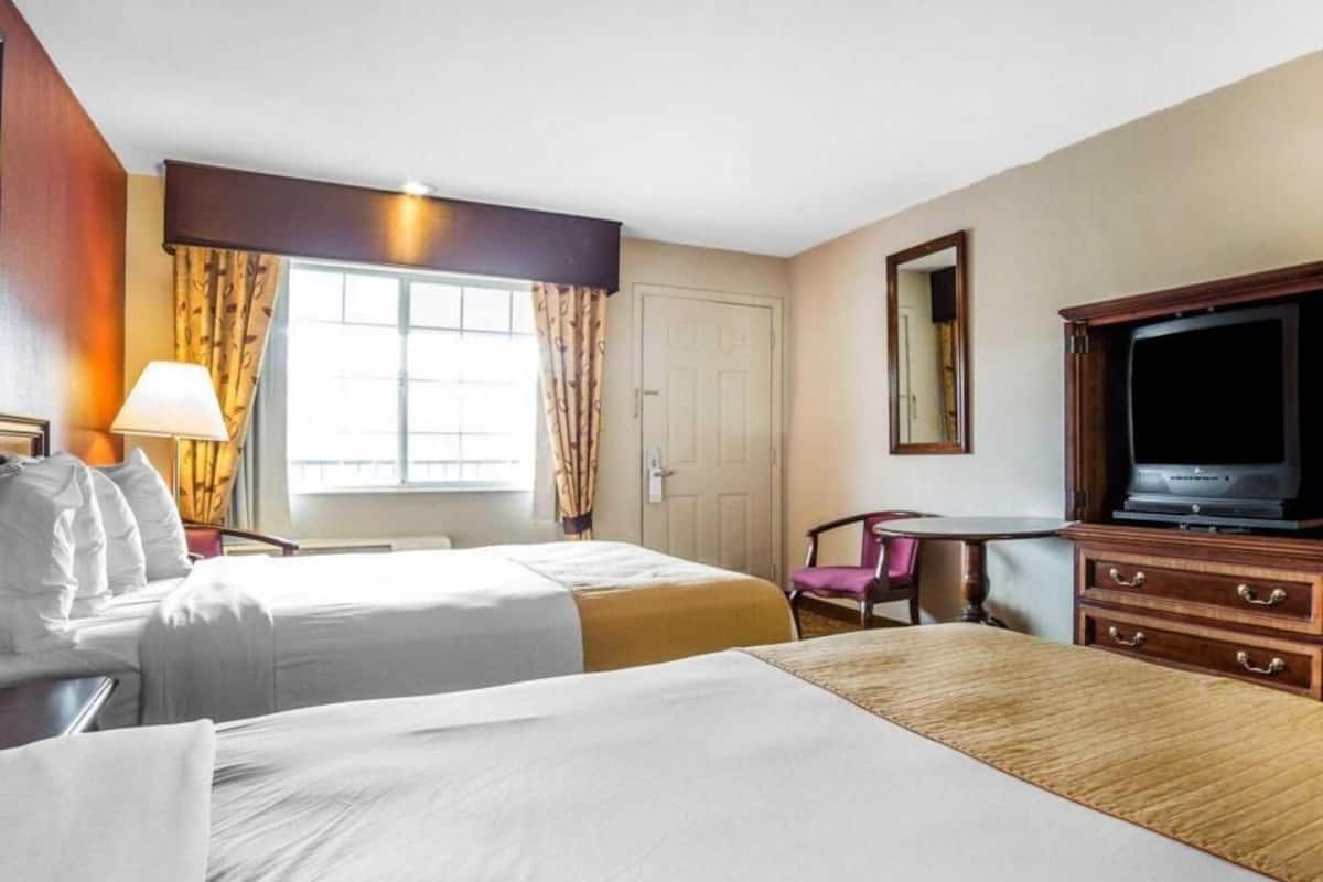 Pillowtop beds, desk, blackout drapes, iron/ironing board